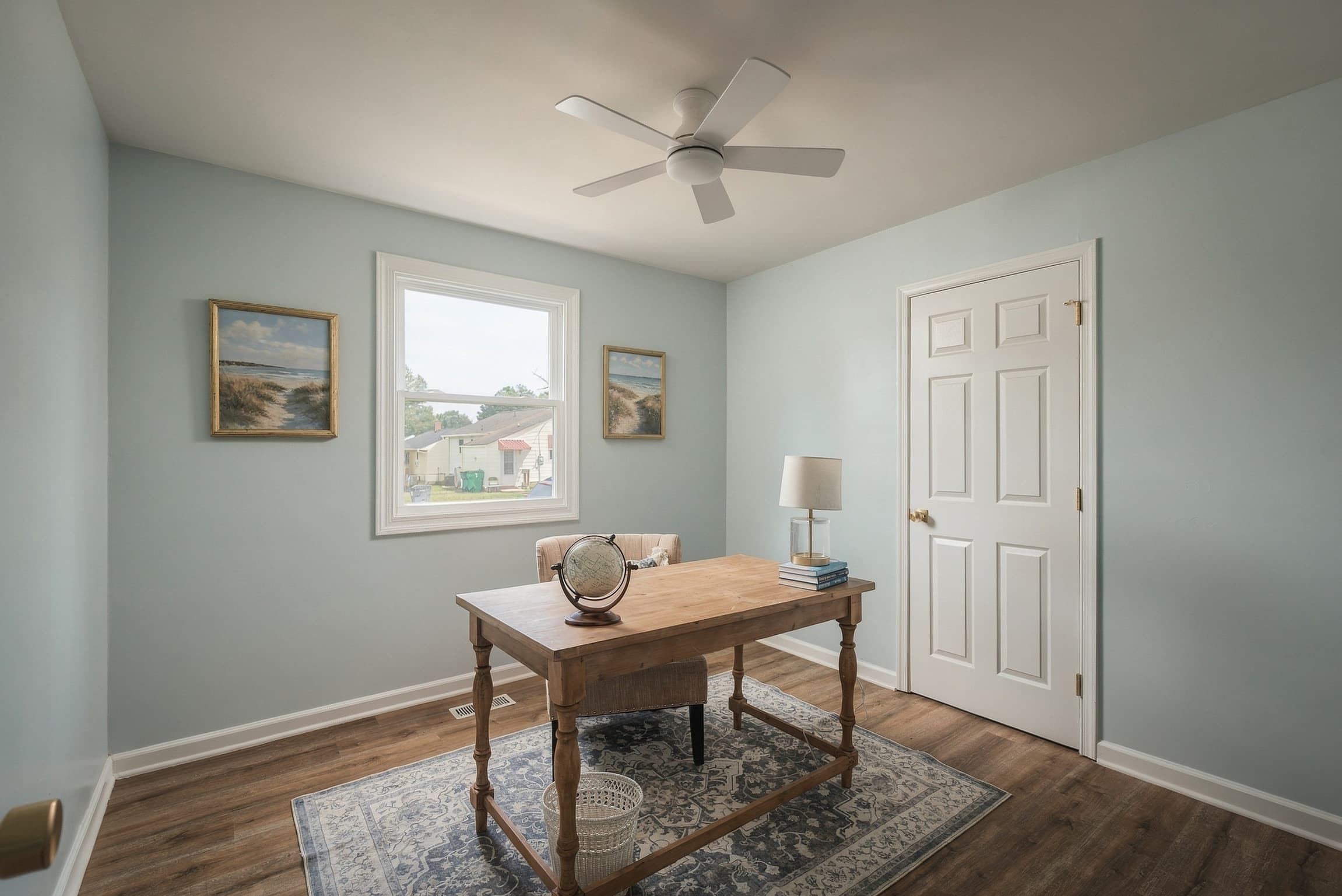 Home office with new floors and a ceiling fan