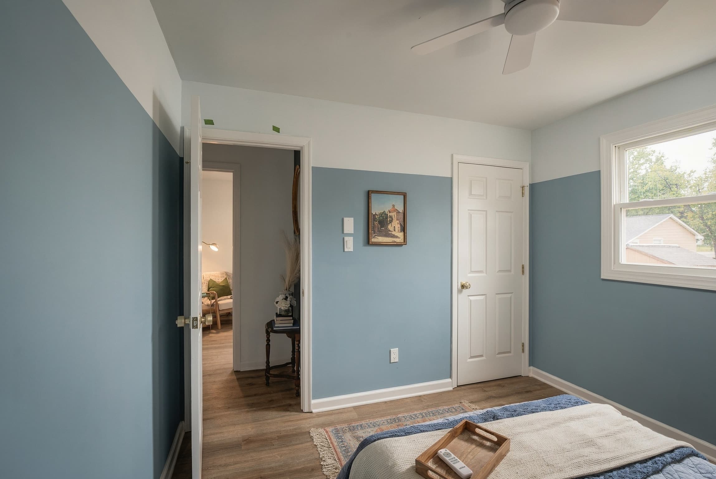 Bedroom with a two-tone blue accent wall
