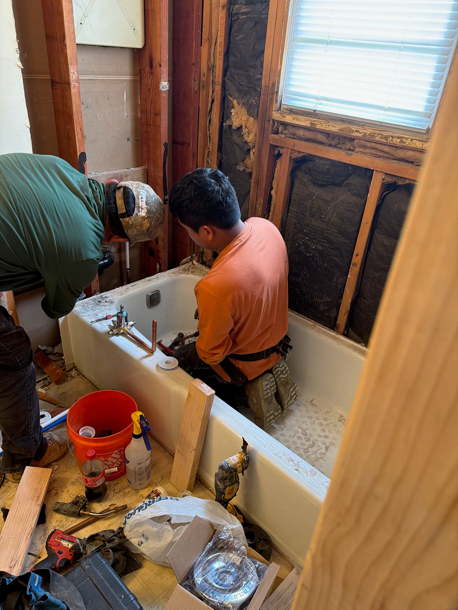 Our plumbers at work on the new tub